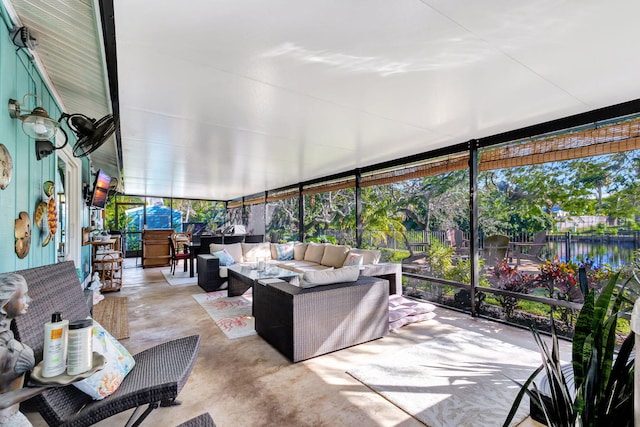 sunroom with a water view