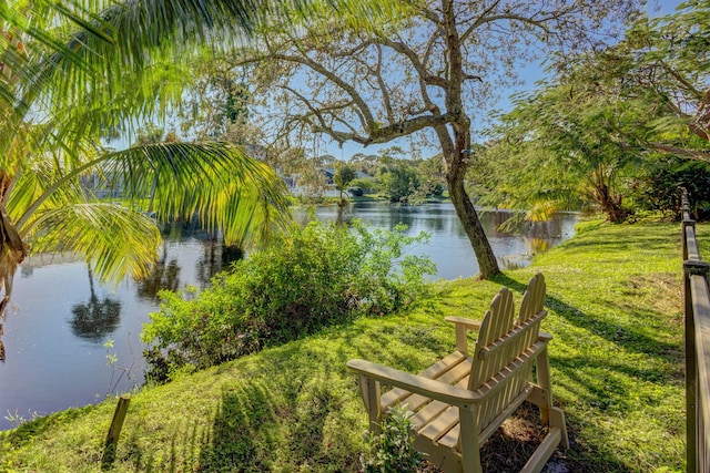 exterior space with a lawn and a water view