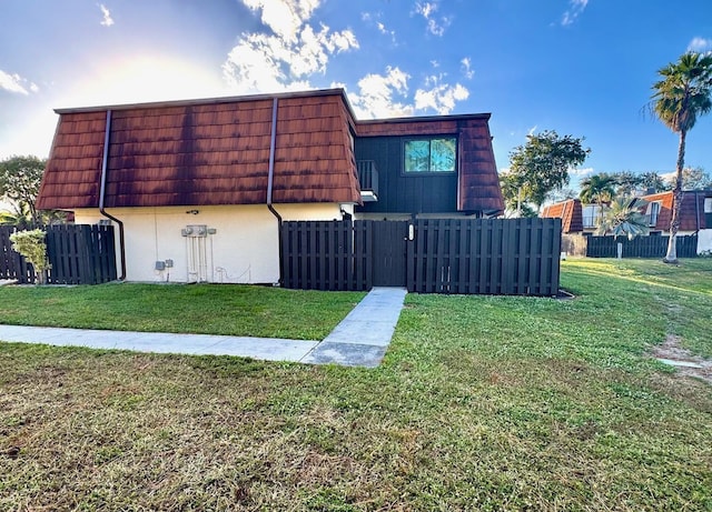 view of property exterior featuring a yard