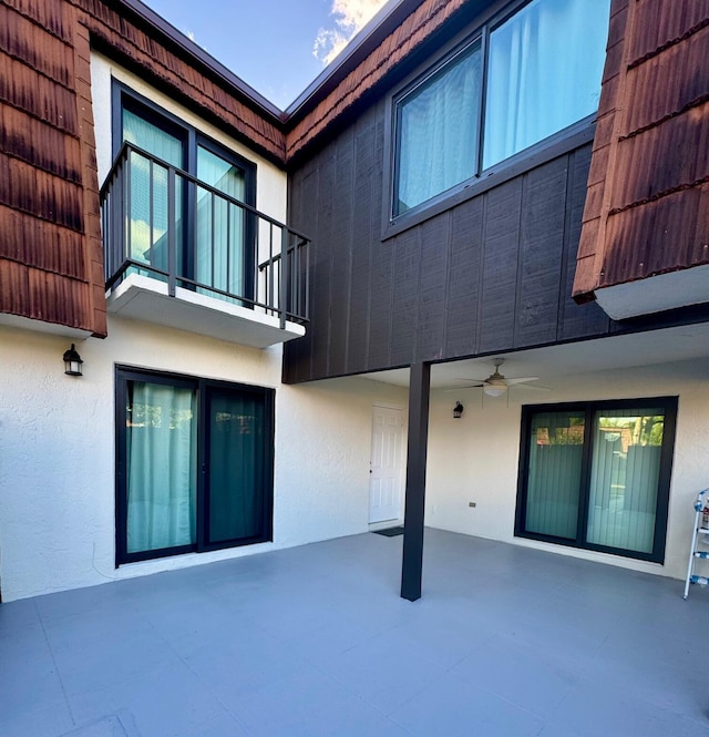 rear view of house with a patio and ceiling fan