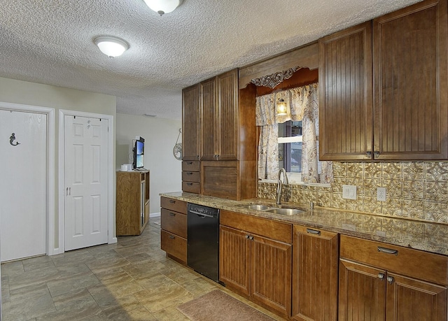 kitchen featuring decorative backsplash, a textured ceiling, black dishwasher, and sink