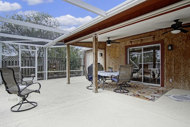 view of patio / terrace with ceiling fan and a lanai