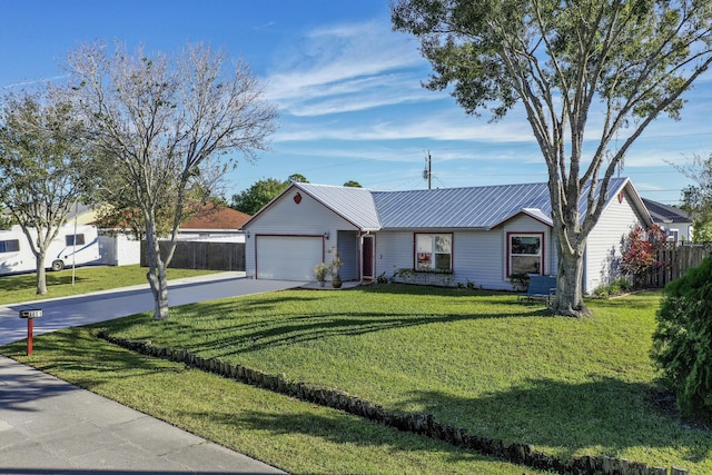 ranch-style house featuring a front yard and a garage