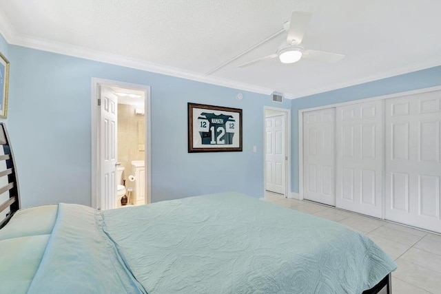 tiled bedroom with connected bathroom, ceiling fan, and crown molding