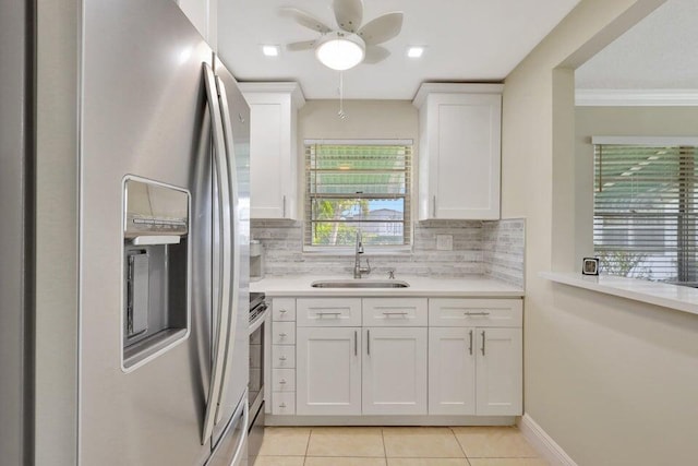 kitchen with white cabinets, stainless steel appliances, a healthy amount of sunlight, and sink