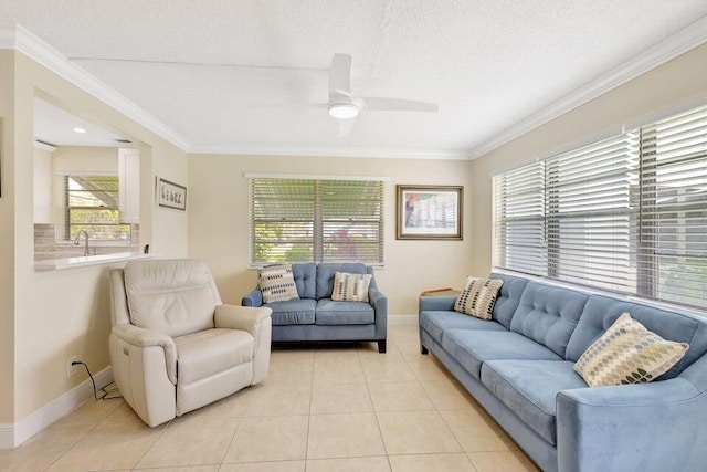 living room featuring ceiling fan, light tile patterned floors, and a wealth of natural light