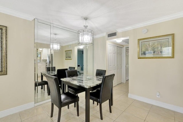 dining area with light tile patterned floors and crown molding