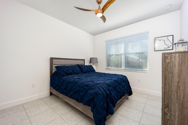 tiled bedroom with ceiling fan