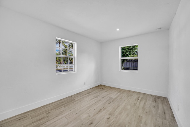 unfurnished room featuring light hardwood / wood-style floors