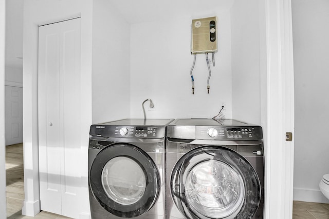 laundry area with washing machine and clothes dryer