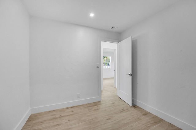 spare room with light wood-type flooring