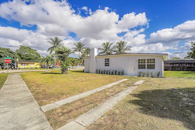 ranch-style house with a front yard