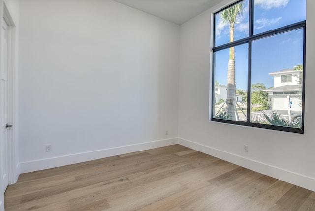18416 Symphony Ct, Jupiter, FL 33458 - empty room with baseboards and light wood-style floors