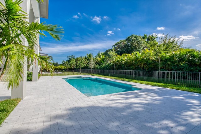 18416 Symphony Ct, Jupiter, FL 33458 - view of swimming pool with a patio area and a fenced backyard