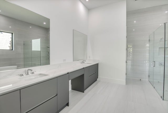 18416 Symphony Ct, Jupiter, FL 33458 - full bath with double vanity, a shower stall, baseboards, recessed lighting, and toilet