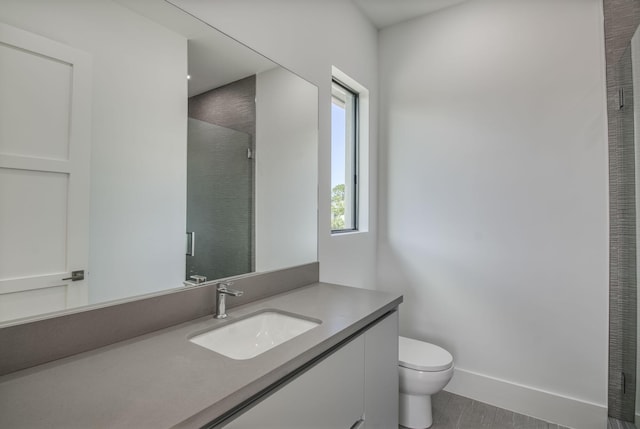 18416 Symphony Ct, Jupiter, FL 33458 - bathroom with vanity, toilet, a stall shower, and baseboards