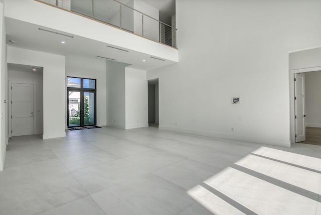 18416 Symphony Ct, Jupiter, FL 33458 - empty room with a towering ceiling and baseboards