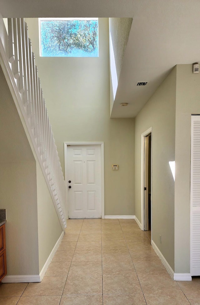 foyer entrance with light tile patterned flooring