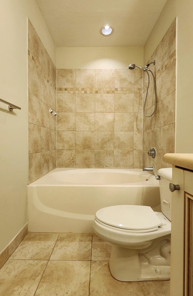 full bathroom with tile patterned flooring, vanity, toilet, and tiled shower / bath combo