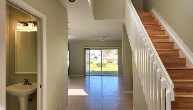 staircase with tile patterned flooring