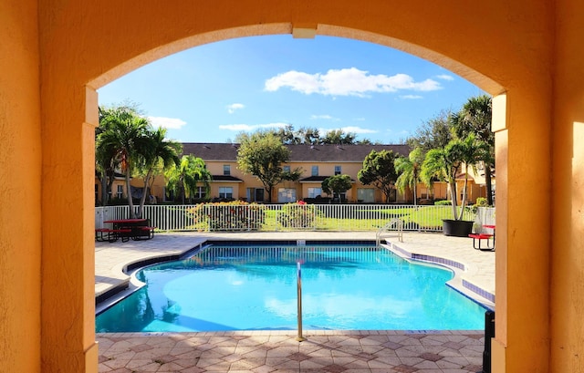 view of swimming pool with a patio