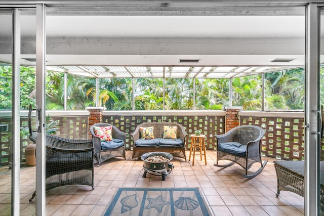 sunroom / solarium featuring a healthy amount of sunlight