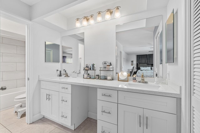 bathroom featuring tile patterned floors, vanity, and toilet