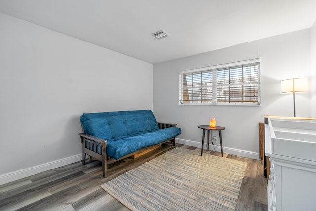 living area with dark hardwood / wood-style floors