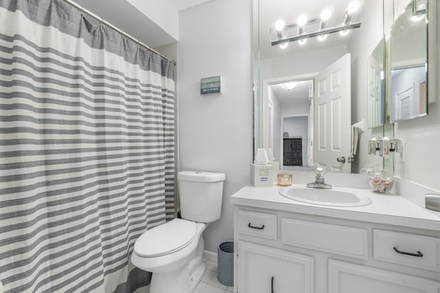 bathroom featuring tile patterned flooring, vanity, curtained shower, and toilet