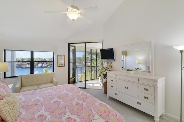 carpeted bedroom featuring access to exterior, ceiling fan, a water view, and high vaulted ceiling