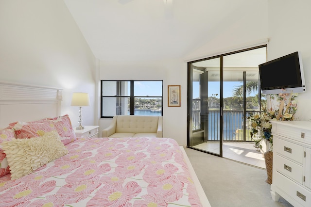 545 Bay Colony Dr N, Juno Beach, FL 33408 - bedroom with access to outside, vaulted ceiling, light carpet, and a ceiling fan