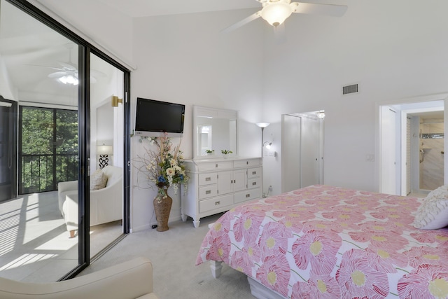 545 Bay Colony Dr N, Juno Beach, FL 33408 - bedroom featuring light colored carpet, a high ceiling, a ceiling fan, and access to outside