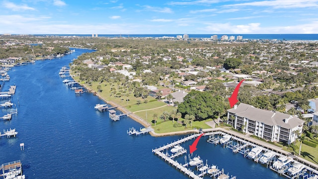 birds eye view of property with a water view