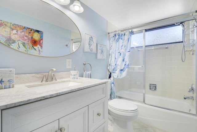 full bathroom with tile patterned floors, vanity, toilet, and bath / shower combo with glass door