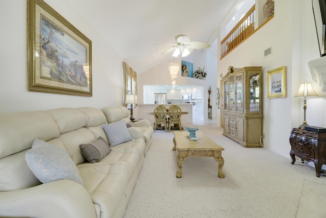 carpeted living room with a wealth of natural light, ceiling fan, and lofted ceiling