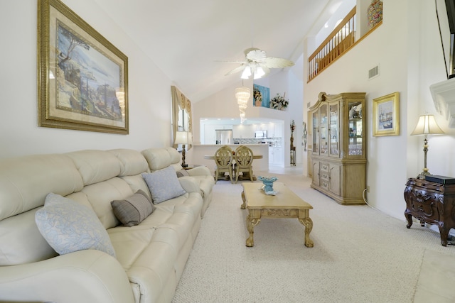 545 Bay Colony Dr N, Juno Beach, FL 33408 - carpeted living room featuring a ceiling fan and high vaulted ceiling