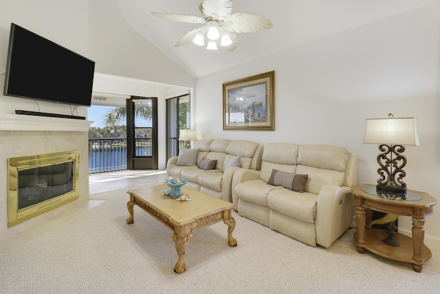 545 Bay Colony Dr N, Juno Beach, FL 33408 - living room with ceiling fan, carpet, a fireplace with flush hearth, and high vaulted ceiling