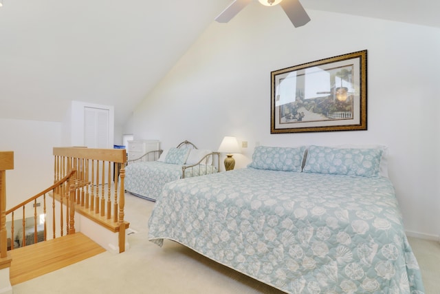 carpeted bedroom featuring vaulted ceiling and ceiling fan