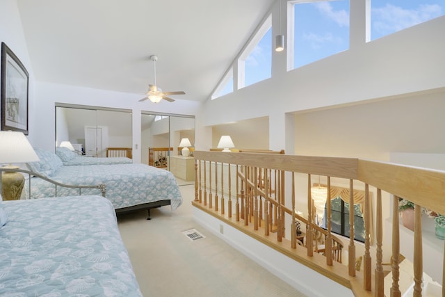 bedroom with multiple windows, ceiling fan, and high vaulted ceiling