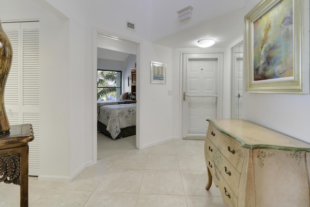 hallway with light tile patterned flooring