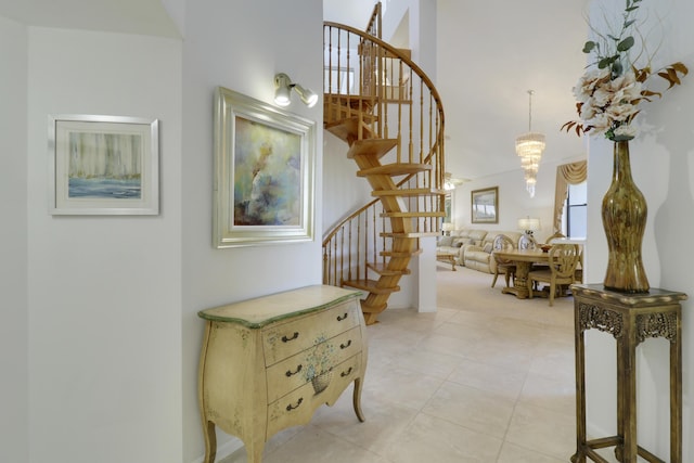 interior space with tile patterned floors and a chandelier