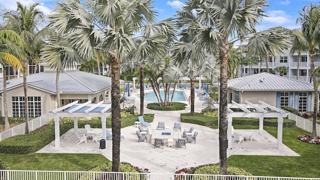 view of patio featuring a pergola and a community pool