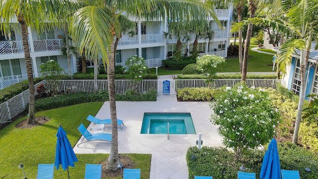 545 Bay Colony Dr N, Juno Beach, FL 33408 - view of pool featuring a pool, a patio, and a community hot tub