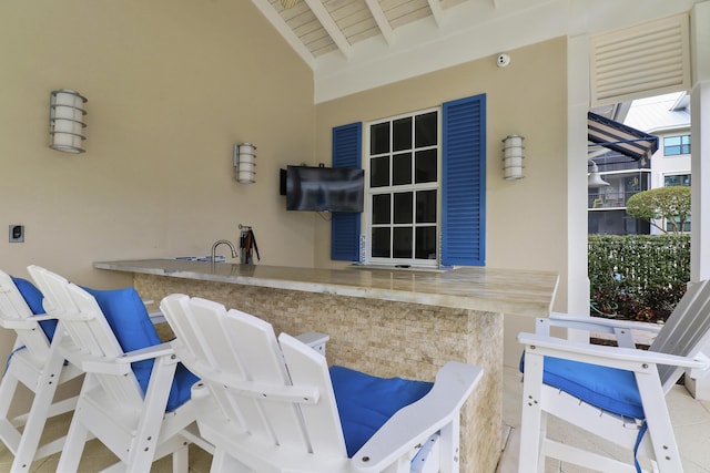 view of patio featuring an outdoor bar