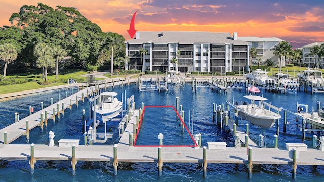 545 Bay Colony Dr N, Juno Beach, FL 33408 - dock with boat lift and a water view