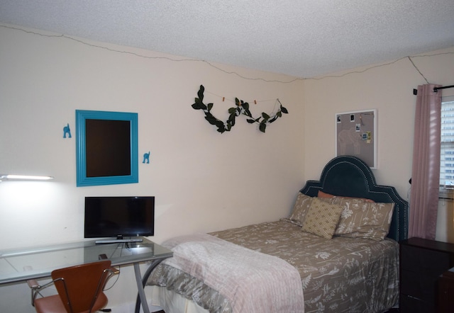 bedroom featuring a textured ceiling