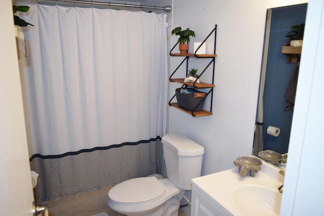 bathroom with vanity, a shower with shower curtain, and toilet