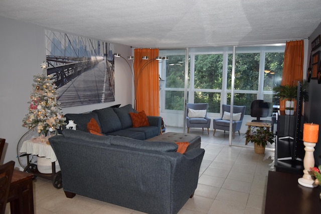 tiled living room featuring a textured ceiling