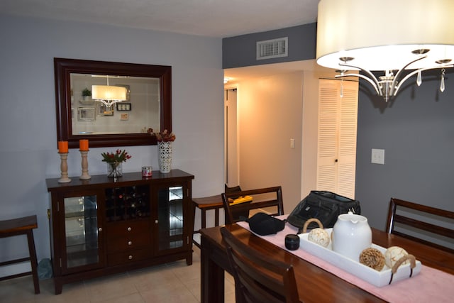 dining space with light tile patterned floors and a baseboard heating unit