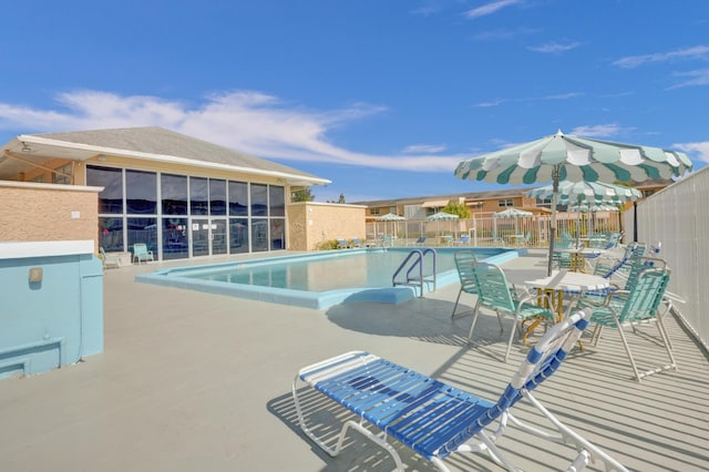 view of swimming pool with a patio area